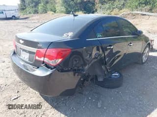 ✅ 2014 Chevrolet Cruze LTZ • VIN: 1G1PG5SBXE7399125 • Lot: 43358990. Listed on IAAI with 128,950 mi. Free auction sales archive from the USA and detailed vehicle history report at DreamBid. Image 4.