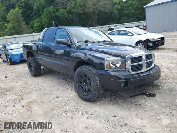 2006 Dodge Dakota SLT with VIN 1D7HE48K66S687229, listed as a Copart auction lot 56238735 with 148,785 mi miles and Salvage title. Bid and sale history available at DreamBid. Image 4.