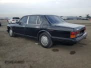 ✅ 1996 Bentley Brooklands • VIN: SCBZE11C4TCX57237 • Лот: 86629574. Опубликован ранее на Copart с пробегом 155 582 миль. Бесплатный доступ к архиву аукционных продаж из США и подробный отчёт об истории автомобиля на DreamBid. Изображение 2.