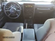 ✅ 2007 Jeep Wrangler Unlimited Sahara • VIN: 1J4GB59197L165422 • Лот: 92529785. Опубликован ранее на Copart с пробегом 148 377 миль. Бесплатный доступ к архиву аукционных продаж из США и подробный отчёт об истории автомобиля на DreamBid. Изображение 8.