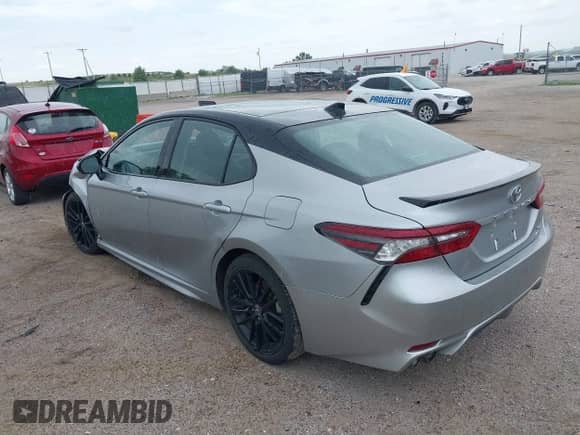 2021 Toyota Camry XSE with VIN 4T1K61BK3MU028249, listed as a IAAI auction lot 42553485 with 130,614 mi miles and . Bid and sale history available at DreamBid. Image 3.