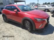 ✅ 2018 Mazda CX-3 Touring • VIN: JM1DKDC77J0329906 • Лот: 70503795. Опубликован ранее на Copart с пробегом 66 398 миль. Бесплатный доступ к архиву аукционных продаж из США и подробный отчёт об истории автомобиля на DreamBid. Изображение 4.