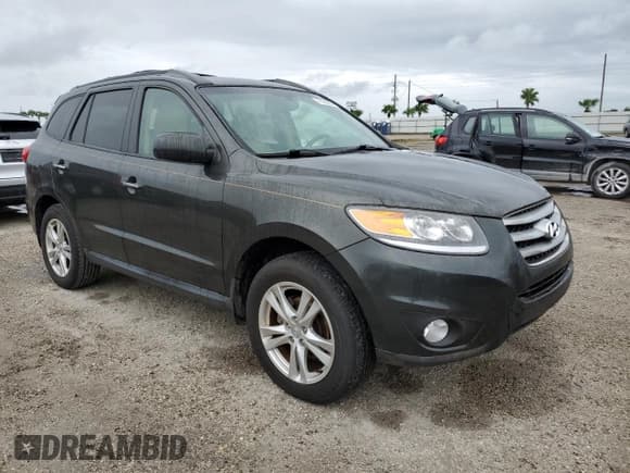 ✅ 2012 Hyundai Santa Fe Limited • VIN: 5XYZK4AG1CG115502 • Lot: 75128574. Listed on Copart with 101,155 mi. Free auction sales archive from the USA and detailed vehicle history report at DreamBid. Image 4.