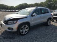 ✅ 2013 Volkswagen Tiguan SE • VIN: WVGBV7AX0DW520423 • Lot: 68394895. Listed on Copart with 128,141 mi. Free auction sales archive from the USA and detailed vehicle history report at DreamBid. Image 1.