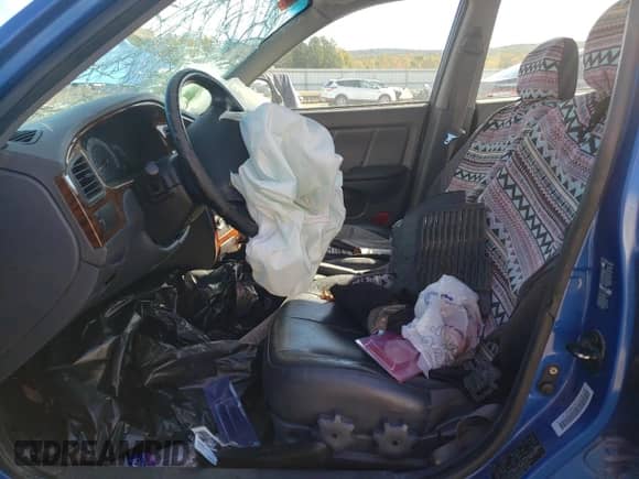 2003 Hyundai Elantra GT z VIN KMHDN55D53U101541, wystawiony jako Copart lot #76377764 z przebiegiem 170 042 mil mil oraz Szkoda całkowita • Salvage title. Historia ofert i sprzedaży dostępna na DreamBid. Obrazek 7.