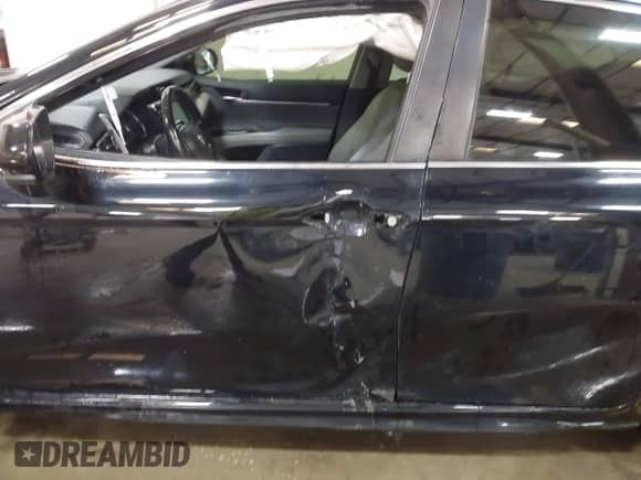 2019 Toyota Camry LE with VIN JTNB11HK0K3080138, listed as a IAAI auction lot 43236866 with 98,032 mi miles and . Bid and sale history available at DreamBid. Image 18.