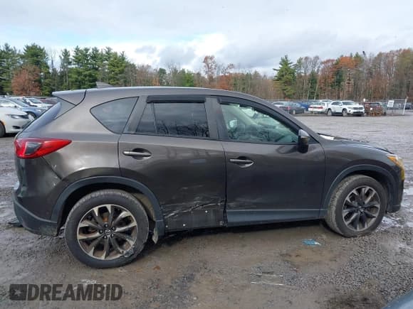 ✅ 2016 Mazda CX-5 Grand Touring • VIN: JM3KE4DY6G0738999 • Лот: 43670069. Опубликован ранее на IAAI с пробегом 168 251 миль. Бесплатный доступ к архиву аукционных продаж из США и подробный отчёт об истории автомобиля на DreamBid. Изображение 13.