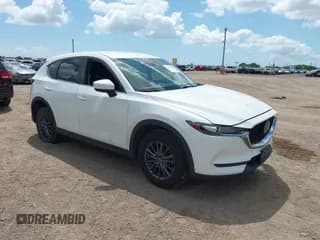 ✅ 2021 Mazda CX-5 Sport • VIN: JM3KFABM0M0409285 • Lot: 43109096. Wystawiony na IAAI z przebiegiem 50 303 mil. Bezpłatny archiwum sprzedaży aukcyjnych z USA i szczegółowy raport historii pojazdu na DreamBid. Zdjęcie 1.