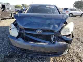 2009 Hyundai Accent GS z VIN KMHCM36C09U130141, wystawiony jako Copart lot #78757034 z przebiegiem 145 482 mil mil oraz Szkoda całkowita • Salvage title. Historia ofert i sprzedaży dostępna na DreamBid. Obrazek 5.