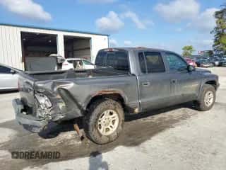 2001 Dodge Dakota Sport z VIN 1B7HG2AN91S333999, wystawiony jako Copart lot #73388754 z przebiegiem 202 759 mil mil oraz Szkoda całkowita • Salvage title. Historia ofert i sprzedaży dostępna na DreamBid. Obrazek 3.