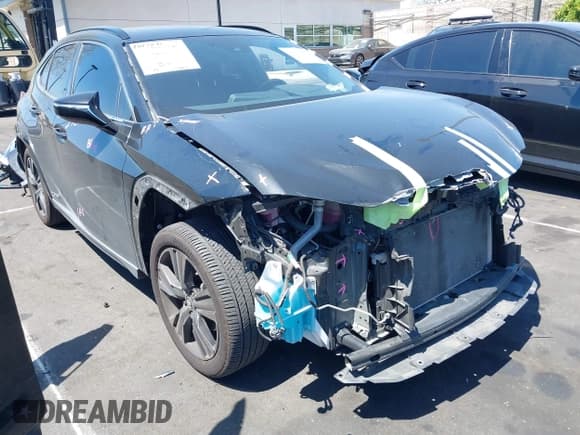 ✅ 2021 Lexus UX 250h • VIN: JTHP9JBH2M2048461 • Лот: 42017871. Опубликован ранее на IAAI с пробегом 56 537 миль. Бесплатный доступ к архиву аукционных продаж из США и подробный отчёт об истории автомобиля на DreamBid. Изображение 1.