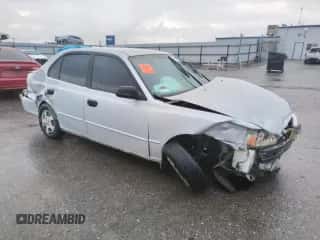 2002 Hyundai Accent GL with VIN KMHCG45C02U301443, listed as a Copart auction lot 80670164 with 124,163 mi miles and Salvage title. Bid and sale history available at DreamBid. Image 4.