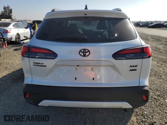 ✅ 2026 Toyota Corolla Cross XLE • VIN: 7MUDAABG0TV150339 • Лот: 91928275. Опубликован ранее на Copart с пробегом 1 034 миль. Бесплатный доступ к архиву аукционных продаж из США и подробный отчёт об истории автомобиля на DreamBid. Изображение 6.