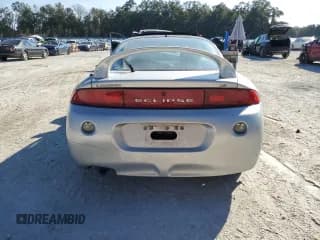 ✅ 1999 Mitsubishi Eclipse GS • VIN: 4A3AK44Y4XE117550 • Лот: 44390295. Опубликован ранее на Copart с пробегом 165 434 миль. Бесплатный доступ к архиву аукционных продаж из США и подробный отчёт об истории автомобиля на DreamBid. Изображение 6.