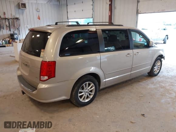 ✅ 2014 Dodge Grand Caravan SXT • VIN: 2C4RDGCG2ER105598 • Lot: 42648383. Listed on IAAI with 103,238 mi. Free auction sales archive from the USA and detailed vehicle history report at DreamBid. Image 4.