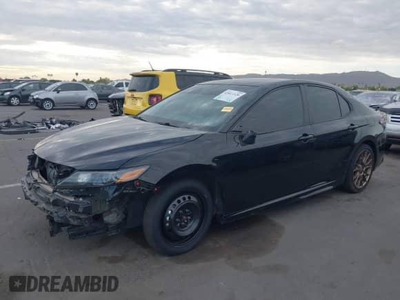 2023 Toyota Camry SE with VIN 4T1G11BK2PU105668, listed as a IAAI auction lot 43013320 with 39,694 mi miles and . Bid and sale history available at DreamBid. Image 2.