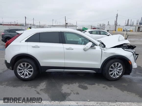 ✅ 2022 Cadillac XT4 FWD Premium Luxury • VIN: 1GYFZCR49NF100393 • Lot: 42497187. Listed on IAAI with 23,672 mi. Free auction sales archive from the USA and detailed vehicle history report at DreamBid. Image 13.