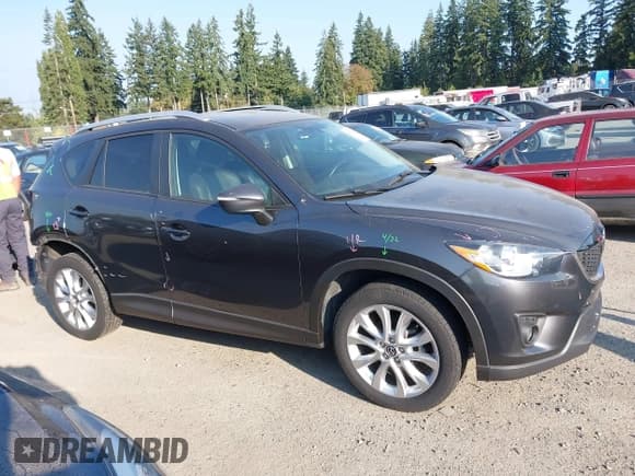 ✅ 2015 Mazda CX-5 Grand Touring • VIN: JM3KE4DY3F0509243 • Lot: 43252834. Listed on IAAI with 139,870 mi. Free auction sales archive from the USA and detailed vehicle history report at DreamBid. Image 14.