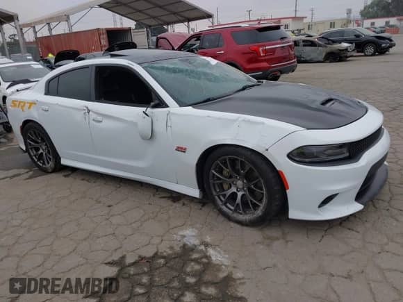 2016 Dodge Charger SRT 392 with VIN 2C3CDXEJ1GH347827, listed as a IAAI auction lot 43011873 with 128,926 mi miles and . Bid and sale history available at DreamBid. Image 1.