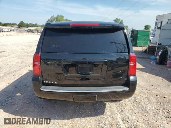 2015 Chevrolet Tahoe LTZ with VIN 1GNSKCKC6FR170659, listed as a Copart auction lot 69412835 with 252,198 mi miles and Salvage title. Bid and sale history available at DreamBid. Image 6.