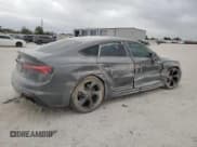 ✅ 2023 Audi RS 5 Sportback • VIN: WUAAWCF54PA901323 • Lot: 78427704. Listed on Copart with 21,901 mi. Free auction sales archive from the USA and detailed vehicle history report at DreamBid. Image 3.