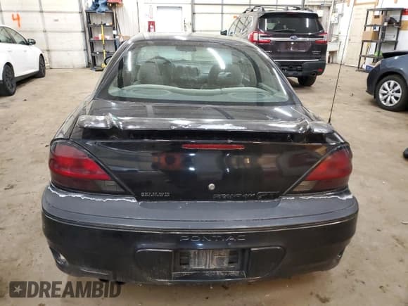 ✅ 2003 Pontiac Grand Am GT • VIN: 1G2NW52EX3M579719 • Лот: 49891365. Опубликован ранее на Copart с пробегом 153 838 миль. Бесплатный доступ к архиву аукционных продаж из США и подробный отчёт об истории автомобиля на DreamBid. Изображение 6.