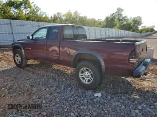2002 Dodge Dakota z VIN 1B7GG12XX2S570878, wystawiony jako Copart lot #75023704 z przebiegiem 109 421 mil mil oraz Szkoda całkowita • Salvage title. Historia ofert i sprzedaży dostępna na DreamBid. Obrazek 2.