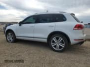 ✅ 2014 Volkswagen Touareg Sport • VIN: WVGDF9BP8ED014612 • Lot: 64328755. Listed on Copart with 212,782 mi. Free auction sales archive from the USA and detailed vehicle history report at DreamBid. Image 2.