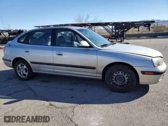 2003 Hyundai Elantra GT z VIN KMHDN55D23U097111, wystawiony jako Copart lot #79975994 z przebiegiem 111 716 mil mil oraz Czysty tytuł • Clean title. Historia ofert i sprzedaży dostępna na DreamBid. Obrazek 4.