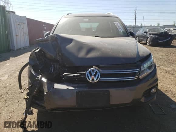 2013 Volkswagen Tiguan SE z VIN WVGAV7AX7DW018388, wystawiony jako Copart lot #56188045 z przebiegiem 98 066 mil mil oraz Szkoda całkowita • Salvage title. Historia ofert i sprzedaży dostępna na DreamBid. Obrazek 5.