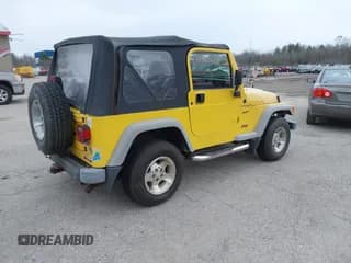 ✅ 2002 Jeep Wrangler Sport • VIN: 1J4FA49S32P710999 • Лот: 43721287. Опубликован ранее на IAAI с пробегом 159 956 миль. Бесплатный доступ к архиву аукционных продаж из США и подробный отчёт об истории автомобиля на DreamBid. Изображение 4.