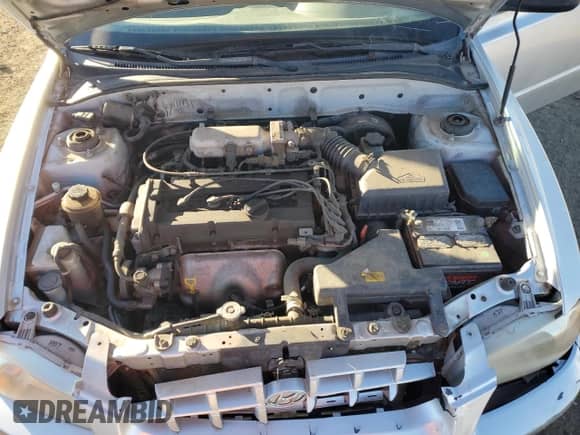 2002 Hyundai Accent GL z VIN KMHCG45C52U313944, wystawiony jako Copart lot #82922304 z przebiegiem 190 208 mil mil oraz Nie do naprawy • Non repairable. Historia ofert i sprzedaży dostępna na DreamBid. Obrazek 11.