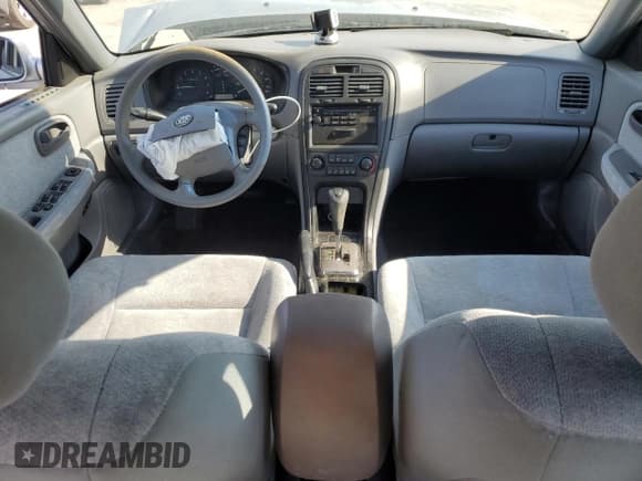 ✅ 2004 Kia Optima LX • VIN: KNAGD126045301139 • Lot: 52876615. Listed on Copart with 165,480 mi. Free auction sales archive from the USA and detailed vehicle history report at DreamBid. Image 8.