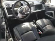 ✅ 2015 Smart fortwo Passion • VIN: WMEEJ3BA6FK807938 • Lot: 53860475. Wystawiony na Copart z przebiegiem 77 748 mil. Bezpłatny archiwum sprzedaży aukcyjnych z USA i szczegółowy raport historii pojazdu na DreamBid. Zdjęcie 8.