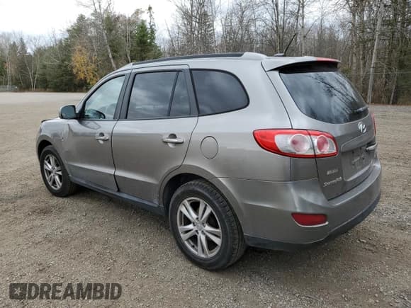 ✅ 2012 Hyundai Santa Fe Limited • VIN: 5XYZHDAG6CG149305 • Lot: 79016974. Listed on Copart with 268,224 mi. Free auction sales archive from the USA and detailed vehicle history report at DreamBid. Image 2.