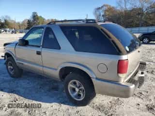 2003 Chevrolet Blazer Xtreme z VIN 1GNCS18X63K132338, wystawiony jako Copart lot #84887164 z przebiegiem 211 194 mil mil oraz Szkoda całkowita • Salvage title. Historia ofert i sprzedaży dostępna na DreamBid. Obrazek 2.