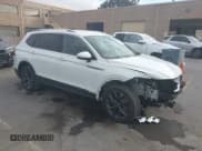 ✅ 2022 Volkswagen Tiguan SE • VIN: 3VV3B7AX2NM020185 • Lot: 42956464. Listed on IAAI with 31,023 mi. Free auction sales archive from the USA and detailed vehicle history report at DreamBid. Image 1.