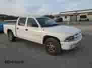 2002 Dodge Dakota SLT with VIN 1B7HL48X92S598972, listed as a Copart auction lot 79393614 with 228,582 mi miles and Salvage title. Bid and sale history available at DreamBid. Image 4.