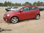 ✅ 2012 Chevrolet Sonic LTZ • VIN: 1G1JE6SH7C4111176 • Lot: 59002575. Listed on Copart with 116,640 mi. Free auction sales archive from the USA and detailed vehicle history report at DreamBid. Image 1.