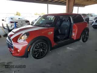 2014 MINI Hardtop S with VIN WMWXM7C56ET988018, listed as a Copart auction lot 64136785 with 73,870 mi miles and Salvage title. Bid and sale history available at DreamBid. Image 1.