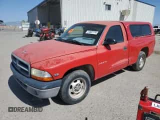 1999 Dodge Dakota SLT z VIN 1B7FL26X0XS114581, wystawiony jako Copart lot #54607174 z przebiegiem Nie podano mil oraz Czysty tytuł • Clean title. Historia ofert i sprzedaży dostępna na DreamBid. Obrazek 1.