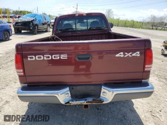 2000 Dodge Dakota Sport z VIN 1B7GG26N5YS546673, wystawiony jako Copart lot #54512715 z przebiegiem 140 904 mil mil oraz Czysty tytuł • Clean title. Historia ofert i sprzedaży dostępna na DreamBid. Obrazek 6.