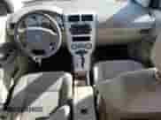 2007 Dodge Caliber SXT z VIN 1B3HB48BX7D587757, wystawiony jako Copart lot #77037124 z przebiegiem 168 505 mil mil oraz Szkoda całkowita • Salvage title. Historia ofert i sprzedaży dostępna na DreamBid. Obrazek 8.