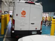 ✅ 2021 Ford Transit Cargo • VIN: 1FTBR2CG0MKB03044 • Lot: 42232122. Wystawiony na IAAI z przebiegiem 100 199 mil. Bezpłatny archiwum sprzedaży aukcyjnych z USA i szczegółowy raport historii pojazdu na DreamBid. Zdjęcie 1.