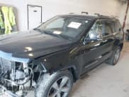 ✅ 2014 Jeep Grand Cherokee Overland • VIN: 1C4RJFCT1EC409613 • Lot: 43415659. Listed on IAAI with 173,712 mi. Free auction sales archive from the USA and detailed vehicle history report at DreamBid. Image 2.