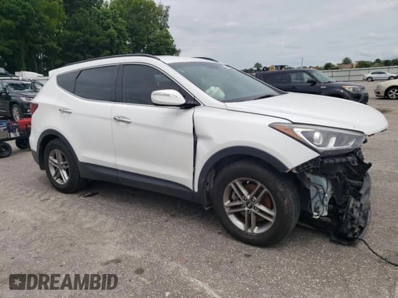 ✅ 2018 Hyundai Santa Fe 2.4L • VIN: 5XYZU3LB4JG515976 • Лот: 64852354. Опубликован ранее на Copart с пробегом 145 375 миль. Бесплатный доступ к архиву аукционных продаж из США и подробный отчёт об истории автомобиля на DreamBid. Изображение 4.