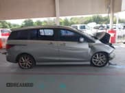 ✅ 2012 Mazda 5 Touring • VIN: JM1CW2CLXC0100950 • Lot: 42648466. Listed on IAAI with 276,752 mi. Free auction sales archive from the USA and detailed vehicle history report at DreamBid. Image 13.