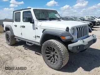 ✅ 2020 Jeep Gladiator Sport S • VIN: 1C6HJTAG3LL125405 • Lot: 43379807. Wystawiony na IAAI z przebiegiem 102 440 mil. Bezpłatny archiwum sprzedaży aukcyjnych z USA i szczegółowy raport historii pojazdu na DreamBid. Zdjęcie 1.