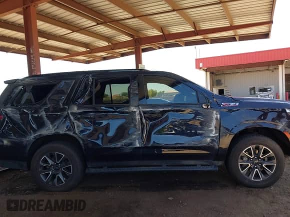 2022 Chevrolet Tahoe Z71 z VIN 1GNSKPKD3NR328938, wystawiony jako IAAI lot #42724313 z przebiegiem 46 394 mil mil oraz . Historia ofert i sprzedaży dostępna na DreamBid. Obrazek 13.