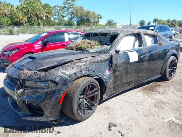✅ 2022 Dodge Charger Scat Pack Widebody • VIN: 2C3CDXGJ4NH121940 • Lot: 37847895. Listed on IAAI with 7,493 mi. Free auction sales archive from the USA and detailed vehicle history report at DreamBid. Image 17.